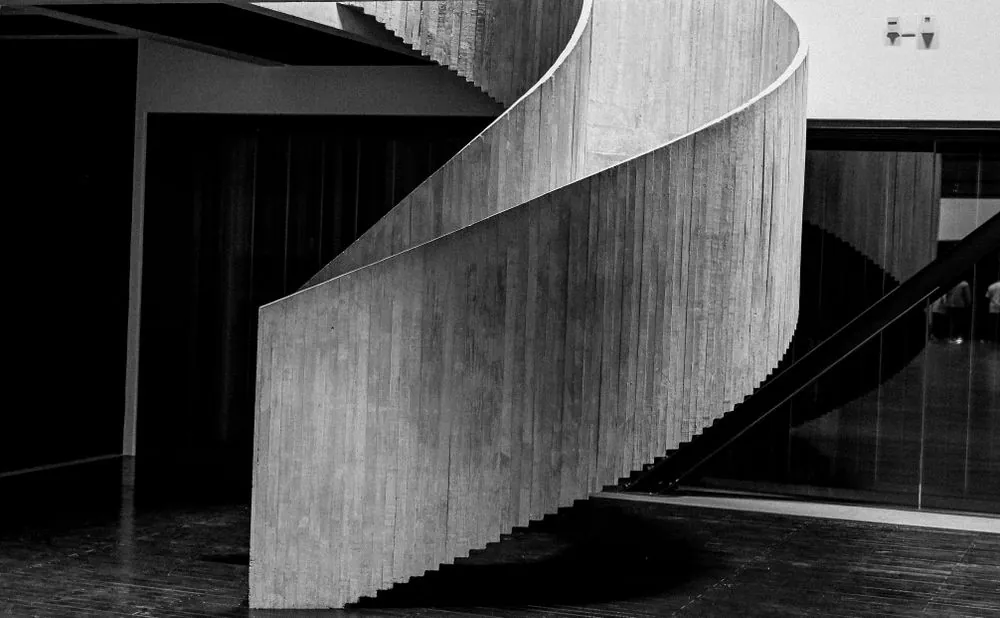 A concrete spiral staircase seen from below